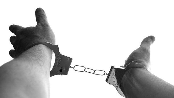 hand in handcuffs
